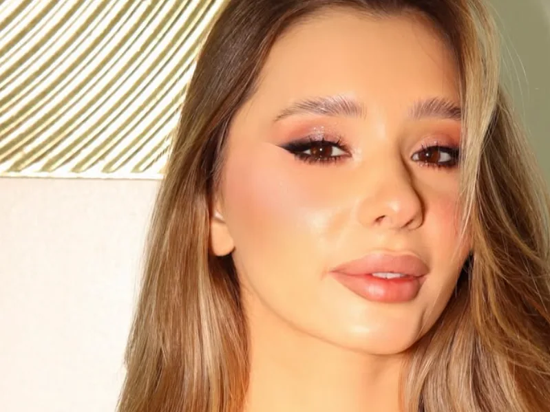 Close-up beauty portrait with defined brows and soft glam eye makeup